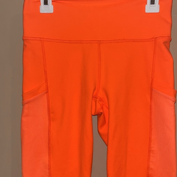 Fabletics Powerhold bright neon orange leggings size XS with mesh side pockets - Picture 2 of 10